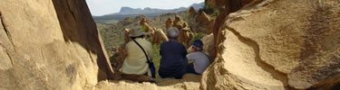 Visitors contemplate the Chihuahuan Desert from Balanced Rock