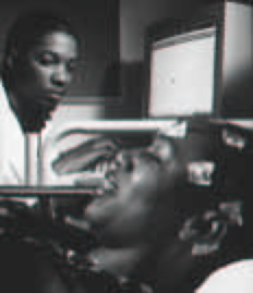 A medical technician carefully monitors a patient undergoing an electroencephalogram, a diagnostic technique used to detect abnormalities in brain waves.