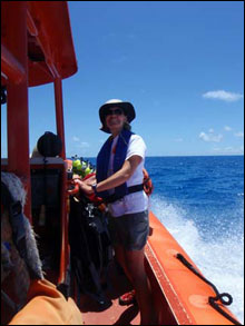 Cathy and the team enjoy blue skies and calm waters on the half hour ride to the dive site.