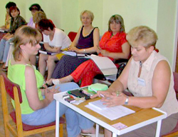 Dr. Skripka, right, practices counseling skills at a training session in Mykolayiv.