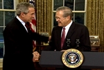 BUSH THANKS RUMSFELD - Click for high resolution Photo