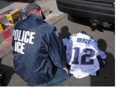 ICE enforcer examining a football jersey.
