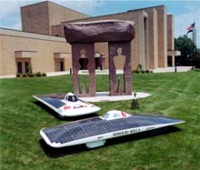 Photo of two solar cars that were built by student teams from the University of Missouri.