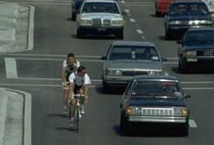 Bicyclists in a wide curb lane.