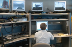 Exercise controllers running a simulation in the laboratory.