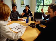 photo of business people meeting at a conference table