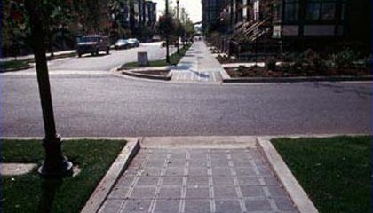 This slide shows three pictures to illustrate different types of pedestrian curb ramps.