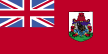 Flag of Bermuda is red, with the flag of the United Kingdom in the upper hoist-side quadrant and the Bermudian coat of arms centered on the outer half of the flag. (Bermudian coat of arms is white and green shield with a red lion holding a scrolled shield showing the sinking of the ship Sea Venture off Bermuda in 1609.)