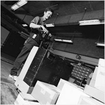 Image of a man moving boxes