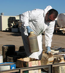 Worker placing pesticides on palette