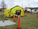 people going inside tent at decon exercise