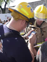 response personnel using handheld device at exercise