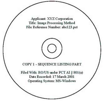 Picture of a compact disc containing a sequence listing part and labeled with the required information listed above.