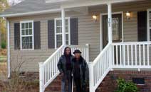 Smitherman Village poster child Easter Butler and her mother Ada at their new home.