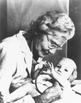 Helen Taussig examining a baby, 1940s 