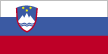 Flag of Slovenia is three equal horizontal bands of white (top), blue, and red, with the Slovenian seal located in the upper hoist side of the flag centered on the white and blue bands. Slovenian seal is a shield with the image of Triglav, Slovenia's highest peak, in white against a blue background at the center; beneath it are two wavy blue lines, and above it are three yellow six-pointed stars arranged in an inverted triangle.