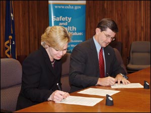 ILMA signs National Alliance on February 9, 2004, Celeste Powers, ILMA Executive Director and then-Assistant Secretary John Henshaw.