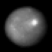 January 2004 image of nearly spherical Ceres from Hubble Space Telescope.