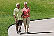Two older people walking