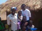 Esperanza, pictured with her home care volunteer and her family, shows that there is hope for people living with HIV and AIDS.