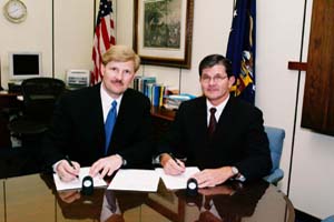 IWLA President and CEO Joel R. Hoiland and OSHA's then-Assistant Secretary of Labor, John Henshaw sign the IWLA Alliance on February 17, 2004.