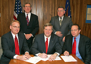 (Seated L to R) Joel Anderson, President and CEO, IWLA; Assistant Secretary Edwin G. Foulke, Jr., USDOL-OSHA and Robert L. Shaunnessey, Executive Director, WERC. (Standing L to R) Patrick O’Connor, Kent and O’Connor, and William Miller, WERC; at the Alliance Addendum signing ceremony on March 29, 2007.