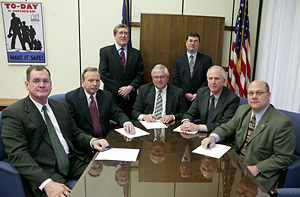 (seated left to right) Ernie Harben, Corporate Manager of Safety, Saddle Creek Corporation; W. Paul Delp, President, Lansdale Warehouse Company; Alex Glann, IWLA, Acting President and CEO; OSHA’s then-Acting Deputy Assistant Secretary, Steven F. Witt; and Douglas J. Sibila, President/CEO, Peoples Services and (standing left to right) Patrick O’Connor, Kent and O’Connor; and Nathan Noy, IWLA, Director of Government and Legal Services; after signing the Alliance.
