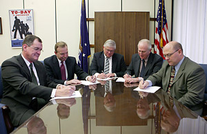 (left to right) Ernie Harben, Corporate Manager of Safety, Saddle Creek Corporation; W. Paul Delp, President, Lansdale Warehouse Company; Alex Glann, IWLA; Acting President and CEO; OSHA’s then-Acting Deputy Assistant Secretary, Steven F. Witt; and Douglas J. Sibila, President/CEO, Peoples Services; sign the Alliance renewal agreement on March 2, 2006.