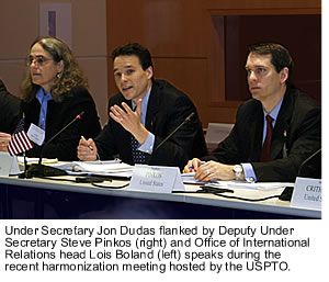 Under Secretary Jon Dudas flanked by Deputy Under Secretary Steve Pinkos (right) and Office of International Relations head Lois Boland (left) speaks during the recent harmonization meeting hosted by the USPTO
