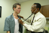 Photo: Man being examined by a Doctor