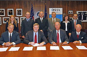 OSHA's Assistant Secretary, Edwin G. Foulke, Jr. and members of The Steel Group (front row, L-R) Thomas A Danjczek, President, Steel Manufactures Association (SMA); Andrew Sharkey, President, American Iron and Steel Institute (AISI); Skip Hartquist, Specialty Steel Industry of North America (SSINA), (back row, L-R) Kristina Cushing, Management, Member Services, SMA; John Carroll, Corporate Director, Safety and Security, IPSCO Enterprises; Ron Herring, Safety Manager, Chaparral Steel; Mike Stokes, EH&S Consultant, Electralloy; Kathryn McMahon-Lohrer, SSINA; Peter Hernandez, Management Advisors