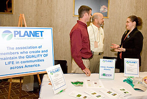 (left to right) PLANET members Josh Kane, Kane Lawn and Landscapes, Inc., Potomac Falls, Virginia; Bern Bonifant, Bay Country Lawns Inc., Fairfax, Virginia and Ilene Manster, PLANET, Membership Retention Coordinator, at the PLANET exhibit booth during the Department of Labor Safety Day