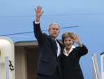 President George W. Bush and Mrs. Laura Bush wave upon their Romanian arrival, April 1, 2008, at Henri Coanda International Airport in Bucharest, site of the 2008 NATO Summit. [White House photo]