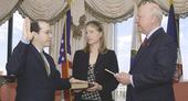 Secretary Bodman administers the oath of office for Andy Karsner as Assistant Secretary for Energy Efficiency and Renewable Energy as his wife, Maria, looks on.