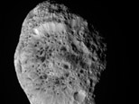 Saturn's Spongy Hyperion Tumbles Into View