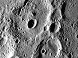 Fresh Crater in Center of Older Crater Basin