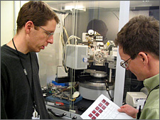 Photo of NREL scientists discussing x-ray diffraction