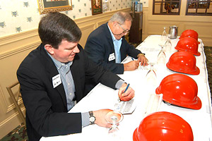 (L-R) OSHA's then-Acting Assistant Secretary Jonathan L. Snare and Andy Anderson, Chairman, NAHB Construction Safety and Health Committee sign Alliance renewal agreement on October 18, 2005.