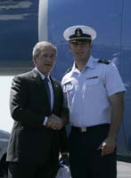 President George W. Bush presented the President’s Volunteer Service Award to Charles England upon arrival at the airport in New London, Connecticut on Wednesday, May 23, 2007.  England is a second-class cadet at the United States Coast Guard Academy and a volunteer with a variety of community organizations.  To thank them for making a difference in the lives of others, President Bush honors a local volunteer when he travels throughout the United States.  President Bush has met with more than 575 individuals around the country, like England, since March 2002.