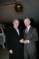 President George W. Bush presented the President’s Volunteer Service Award to Dennis Jones upon arrival at the airport in Springfield, Missouri, on Thursday, November 2, 2006.  Jones is a volunteer with the Springfield Chapter of SCORE - Counselors to America’s Small Business.  To thank them for making a difference in the lives of others, President Bush honors a local volunteer, called a USA Freedom Corps Greeter, when he travels throughout the United States.  President Bush has met with more than 550 individuals around the country, like Jones, since March 2002.