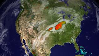 A view of fire incidence in the United States on May 12, 2002, as seen by the MODIS instrument on the Terra satellite.  Superimposed over the fires are cloud data in white from GOES and precipitation data in orange and yellow from TRMM.