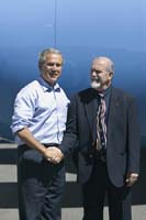 President George W. Bush met Rod Conover upon arrival in Farmington, New Mexico, on Thursday, August 26, 2004.  Conover, 67, is an active volunteer with a number of organizations in his community including Project Read, an adult literacy program. 