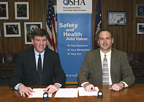 (L-R) OSHA's then-Acting Assistant Secretary Jonathan L. Snare and Jim Thacker, Executive Director, NAILM sign national Alliance on February 9, 2005.