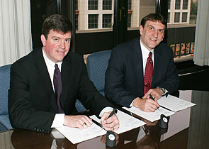 (L-R) OSHA’s then-Acting Assistant Secretary, Jonathan L. Snare and Richard Patterson, Managing Director, Sporting Arms and Ammunition Manufactures’ Institute Inc. renew national Alliance agreement May 19, 2005.
