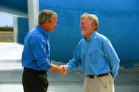 President George W. Bush met Curtis Hardie upon arrival at the Deschutes National Forest, on Thursday, August 21, 2003. Since 1993, Hardie has been an active volunteer within the Deschutes National Forest helping to maintain trails and recreation areas for the public to enjoy.