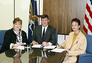 Pamela Sue Lauritzen, Founder, ISCC, Jonathan L. Snare, OSHA's then-Acting Assistant Secretary, and Melissa Sirianni, ISCC Safety Director, sign national Alliance on October 3, 2005.