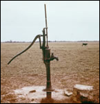 Photo: Improper slab height of a water well could produce inadequate drainage, which could cause contamination of the water supply. Photo credit: Public Health Image Library
