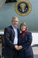 President George W. Bush met Lisa Gibney upon arrival in Cedar Rapids, Iowa, on Friday, September 3, 2004.  Gibney is a trained first responder volunteer with a number of public safety organizations in her community.