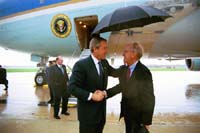President George W. Bush met John Sant upon arrival in St. Louis, Missouri, on Wednesday, April 16, 2003. For more than 10 years, Sant has been an active volunteer helping to improve academic acheivement among disadvantaged students. 
