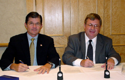Assistant Secretary of Labor, John Henshaw and Robert D. Morrison, Divisional Vice President-Corporate Environment, Health, Safety and Energy, Abbott Laboratories sign National Alliance on September 10, 2003